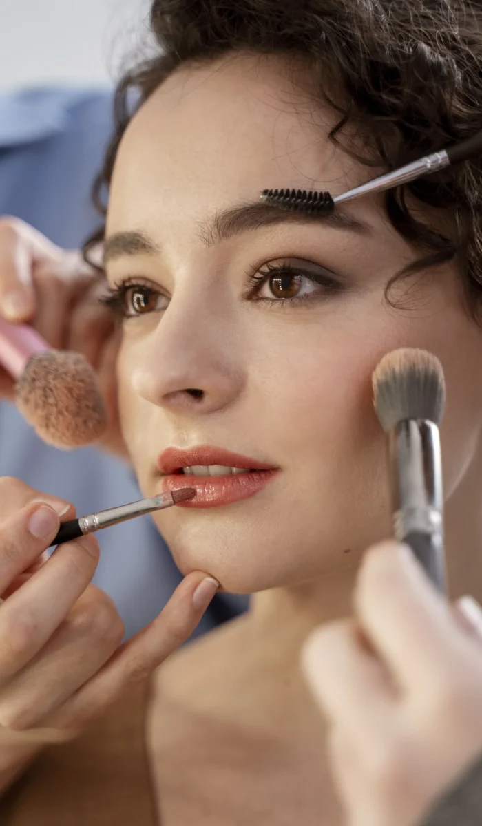 make-up-artist-getting-model-ready-photoshootin